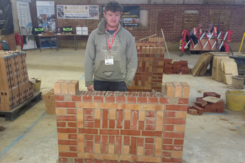 Alfie with his finished brick wall